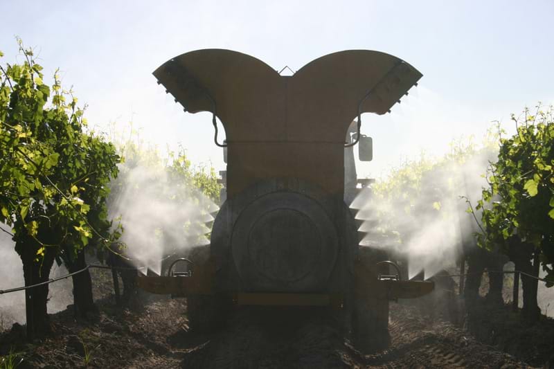 Air-O-Fan orchard sprayer working in tree rows