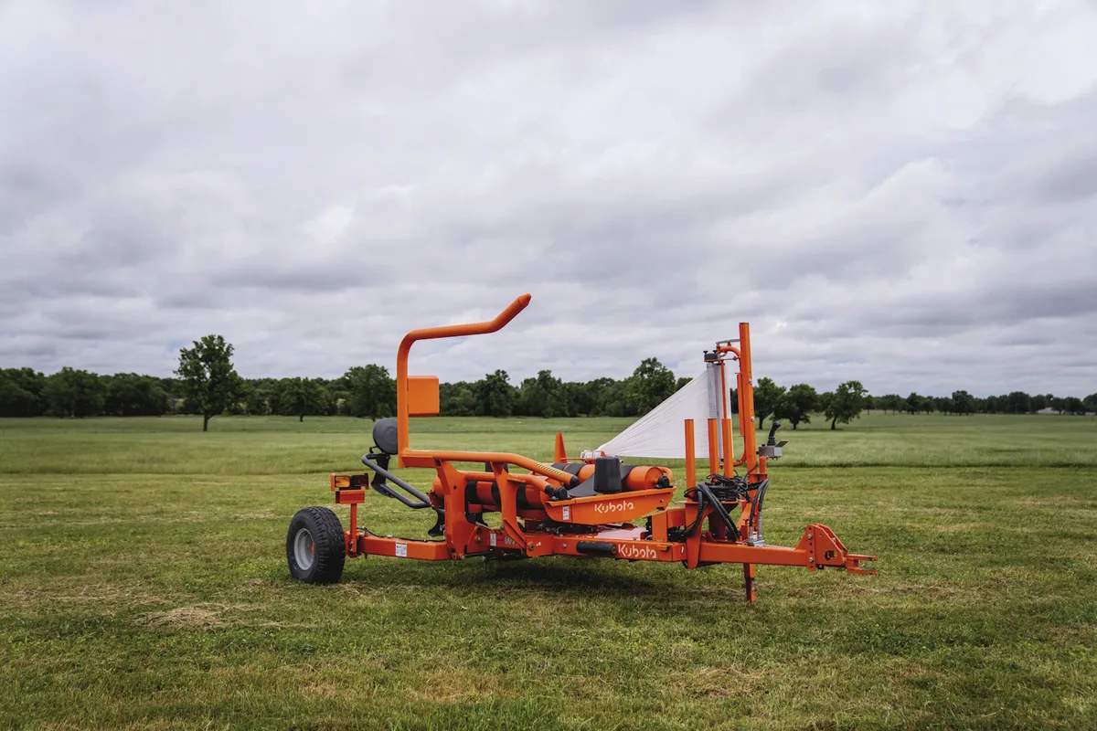 Kubota WR bale wrapper in a hay field