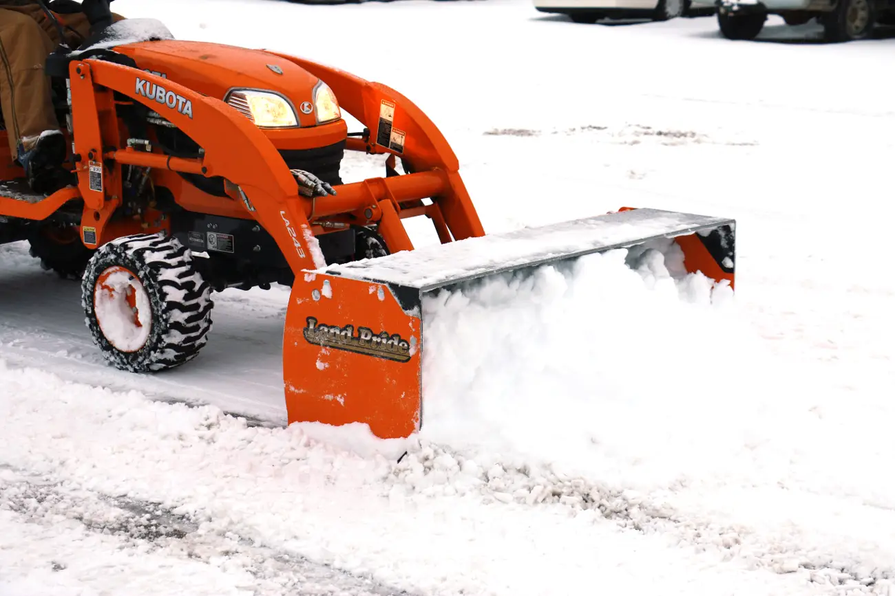 Land Pride SPL snow pusher clearing snow with a Kubota tractor