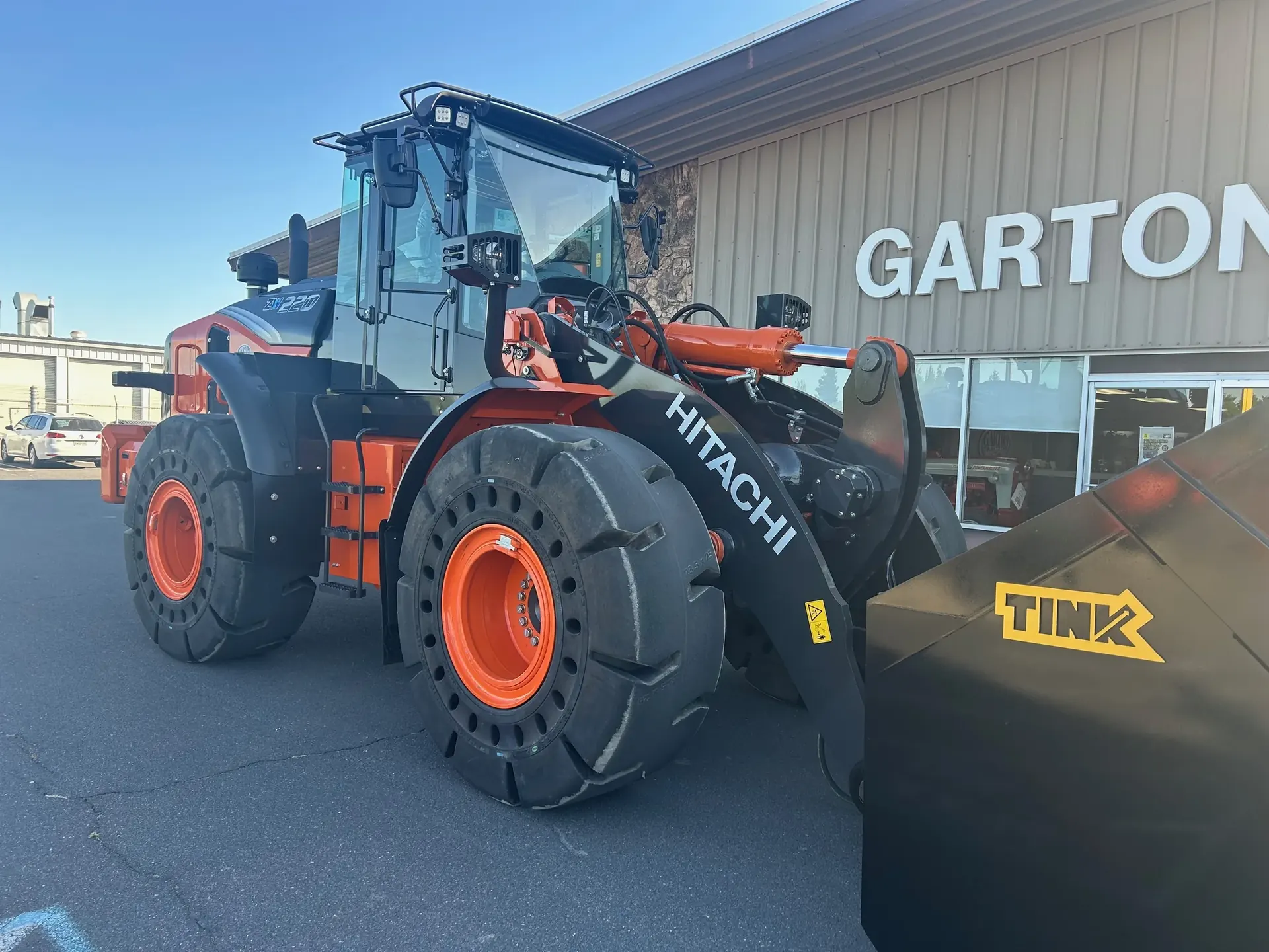 Hitachi ZW220 wheel loader with a Tink bucket outside Garton Tractor