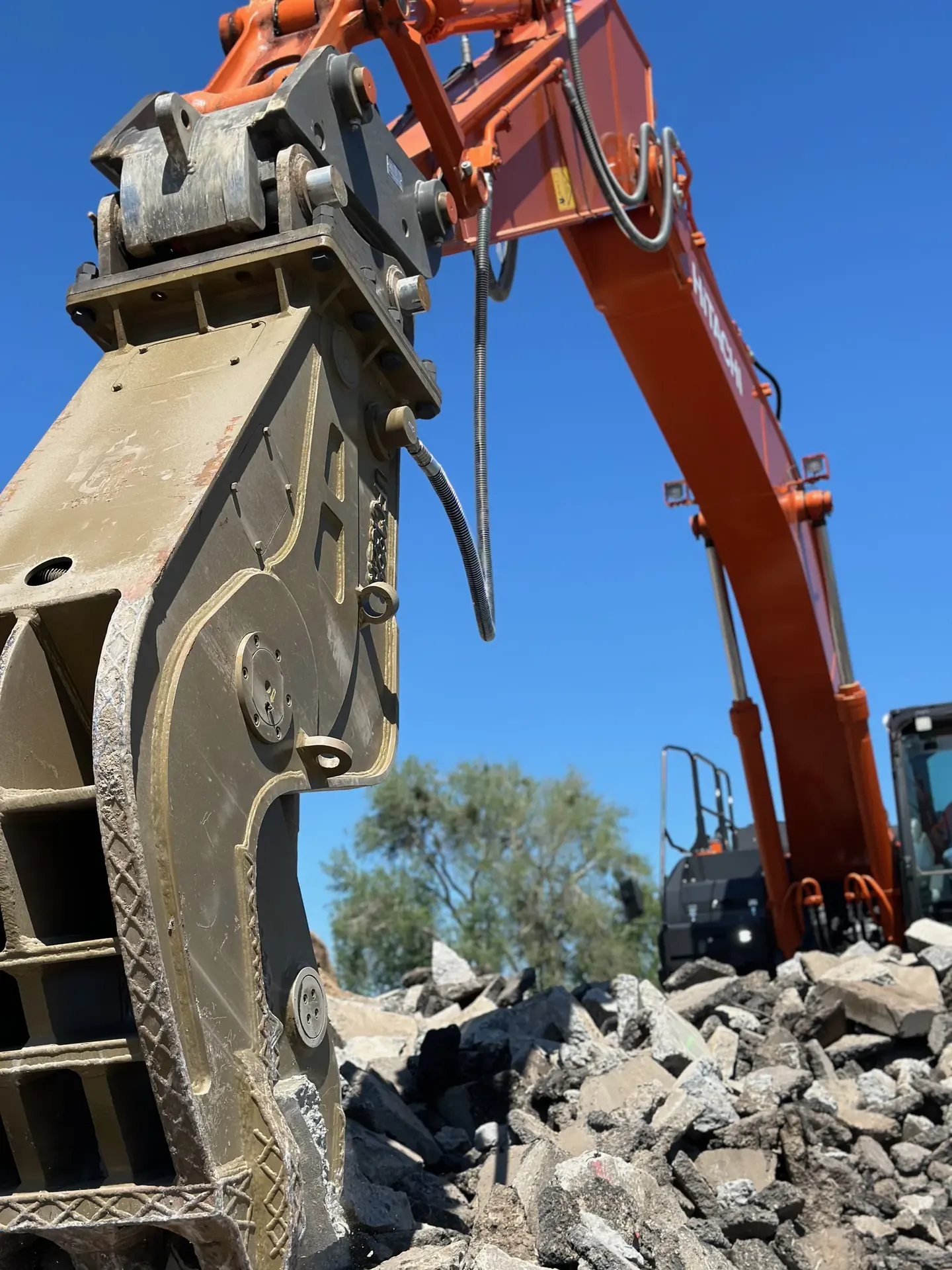 Hitachi excavator using a demolition attachment